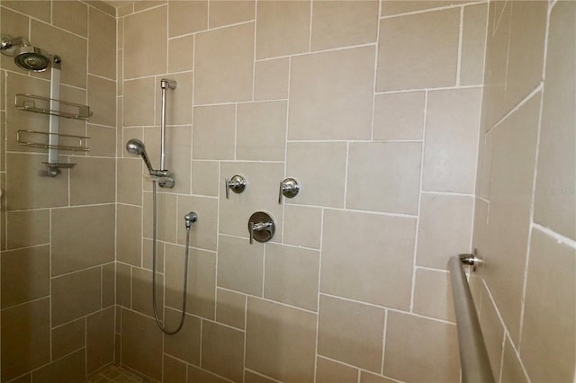 bathroom with a tile shower