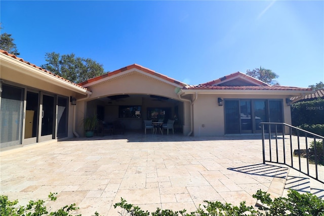 rear view of property featuring a patio