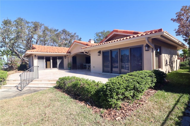 rear view of house featuring a patio