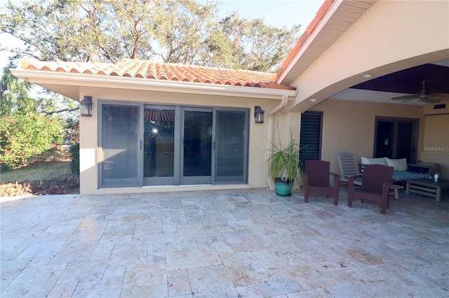 view of patio / terrace featuring ceiling fan and an outdoor living space