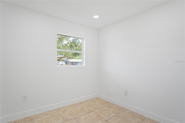 unfurnished room featuring light tile patterned floors