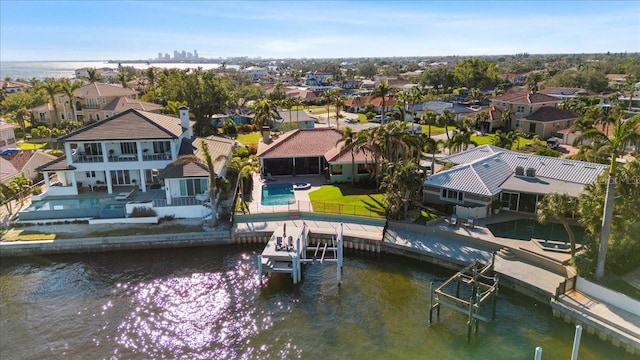 birds eye view of property featuring a water view