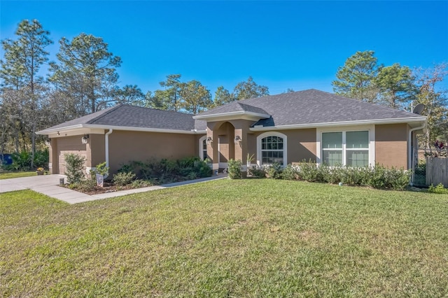 ranch-style home featuring a garage and a front lawn