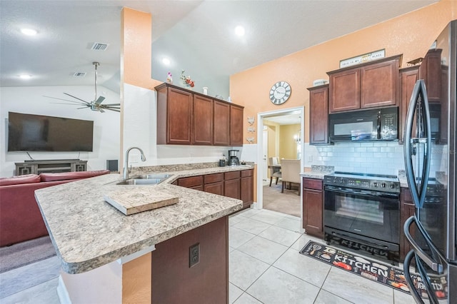 kitchen with black appliances, sink, ceiling fan, light tile patterned floors, and kitchen peninsula