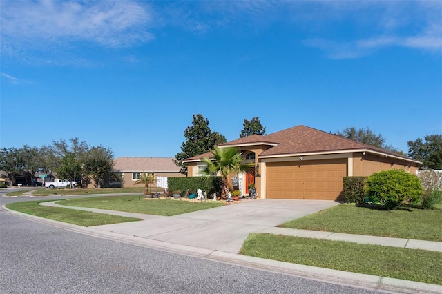 ranch-style home featuring a front yard and a garage