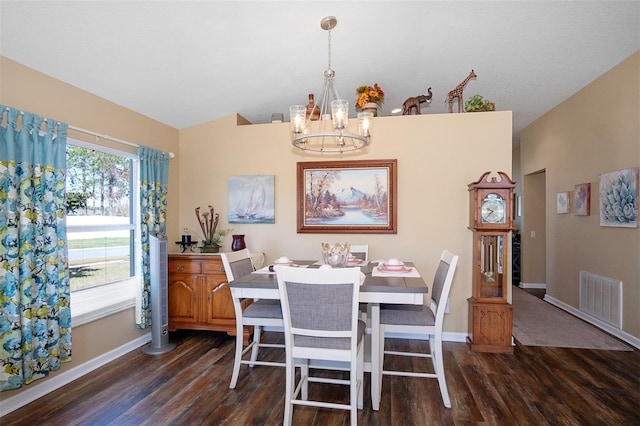 dining area featuring a chandelier, dark hardwood / wood-style floors, and a wealth of natural light