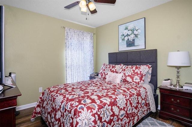 bedroom with dark hardwood / wood-style floors and ceiling fan