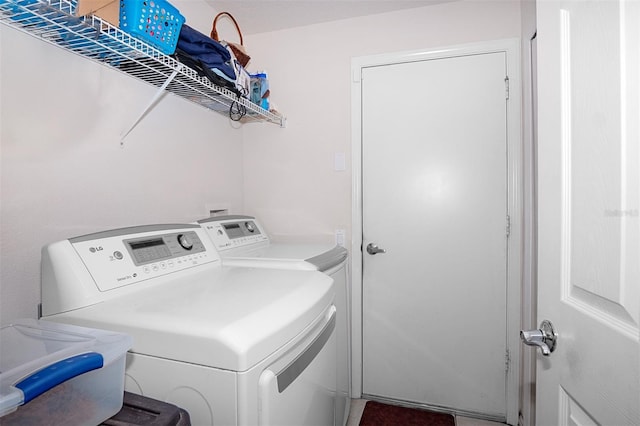 washroom with washer and dryer