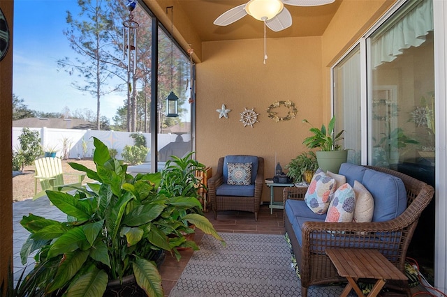 sunroom / solarium with ceiling fan