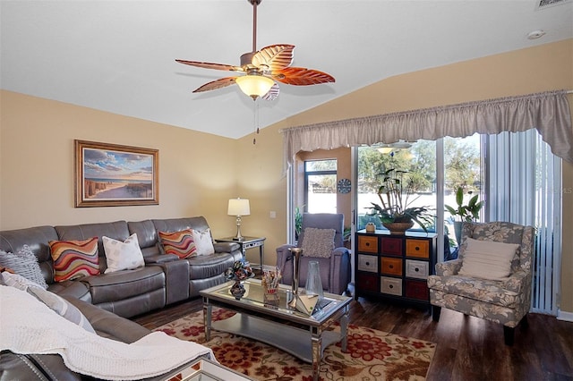 living room with dark hardwood / wood-style floors, ceiling fan, and lofted ceiling