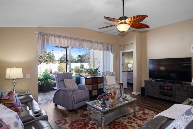 living room with dark hardwood / wood-style flooring, ceiling fan, and lofted ceiling