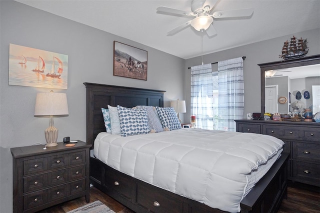 bedroom with ceiling fan and dark hardwood / wood-style flooring