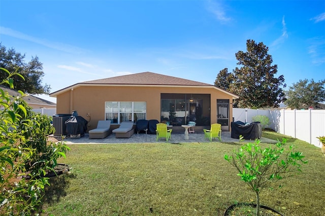 back of house with a lawn, a patio area, central air condition unit, and outdoor lounge area