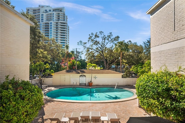 view of pool featuring a patio