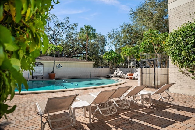 view of swimming pool featuring a patio area