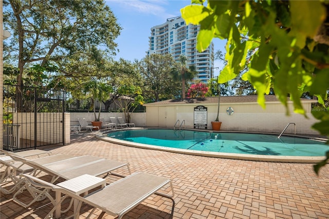 view of swimming pool with a patio area