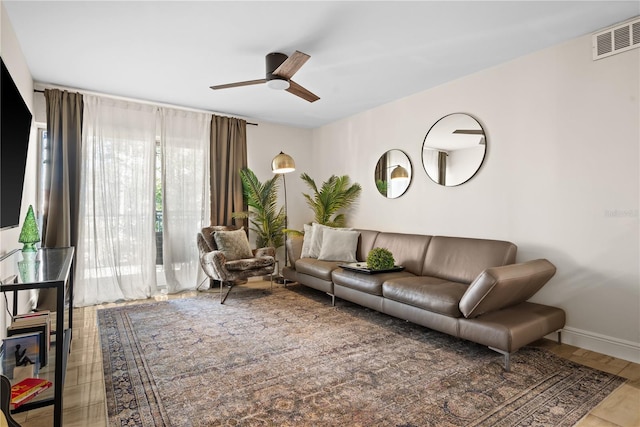 living room with hardwood / wood-style flooring and ceiling fan