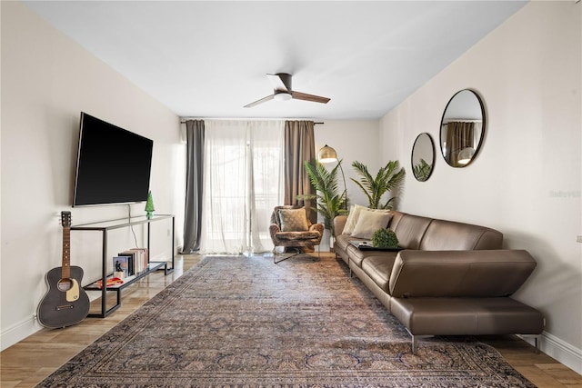 living room with ceiling fan and hardwood / wood-style floors