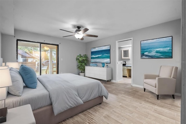 bedroom featuring access to exterior, light hardwood / wood-style floors, ensuite bath, and ceiling fan