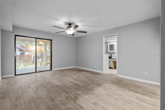 spare room featuring ceiling fan and light hardwood / wood-style floors