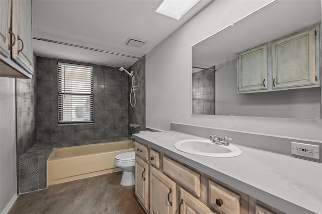 full bathroom featuring wood-type flooring, vanity, toilet, and tiled shower / bath