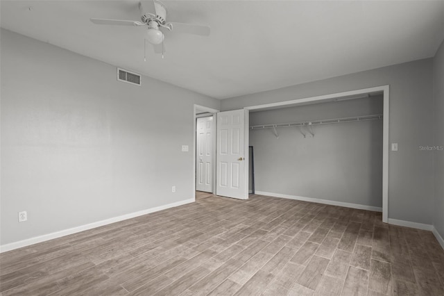 unfurnished bedroom with a closet, ceiling fan, and light hardwood / wood-style flooring