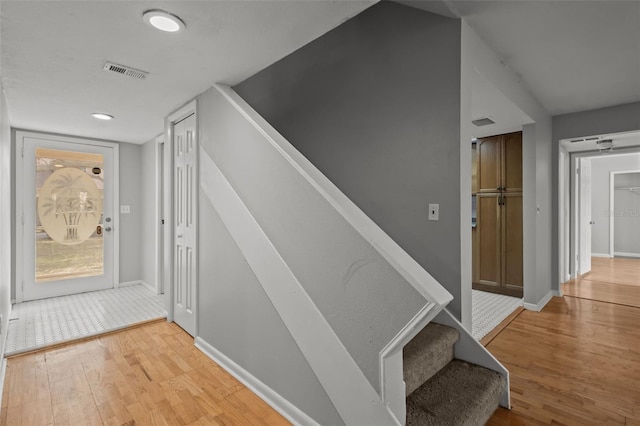 staircase featuring wood-type flooring