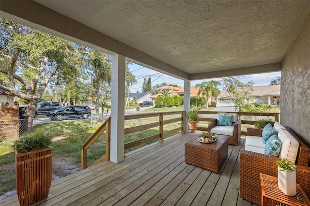 wooden deck featuring an outdoor living space