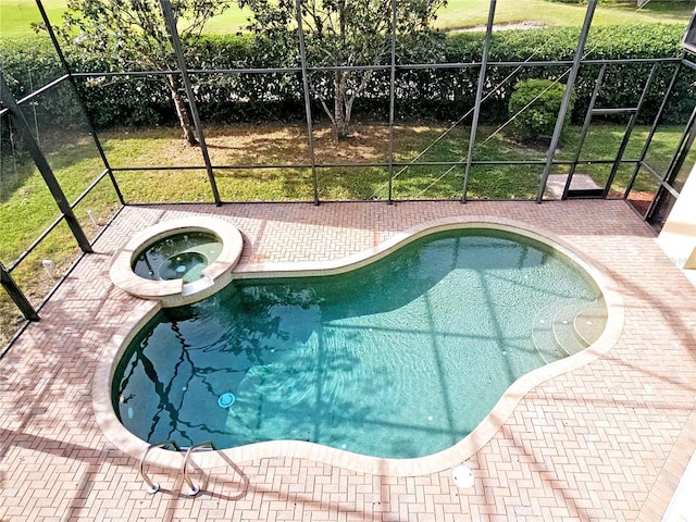 view of pool featuring a patio area and an in ground hot tub