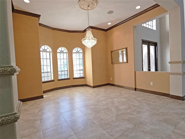 unfurnished dining area with crown molding, plenty of natural light, and a chandelier