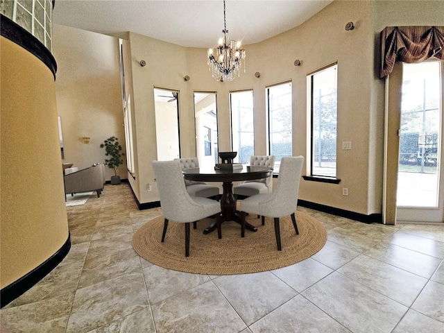 tiled dining area with a chandelier