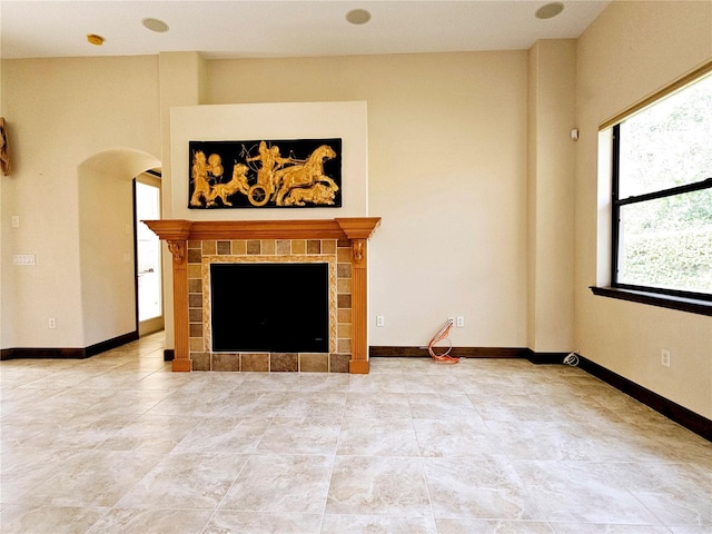 unfurnished living room featuring a fireplace