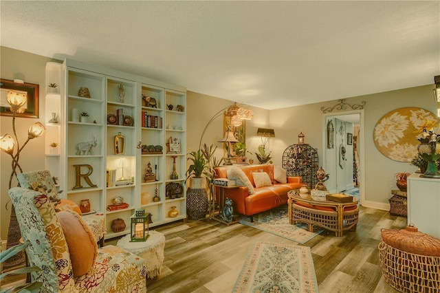 living area featuring hardwood / wood-style floors and a textured ceiling