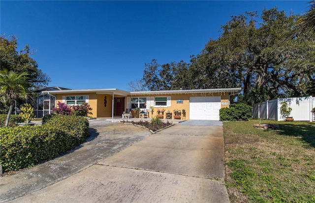 ranch-style house featuring a garage and a front yard