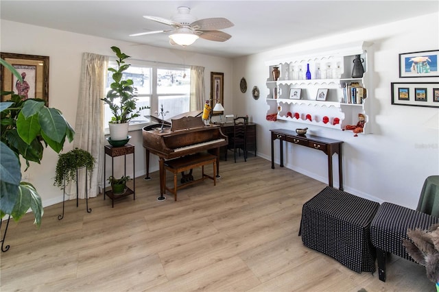 miscellaneous room with ceiling fan and light hardwood / wood-style floors