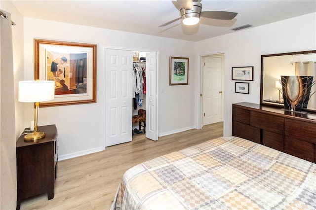 bedroom with light hardwood / wood-style floors, a closet, and ceiling fan