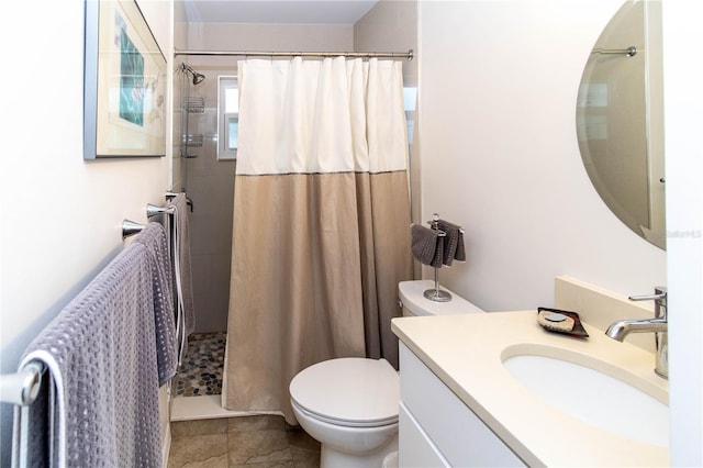 bathroom with vanity, toilet, and a shower with shower curtain