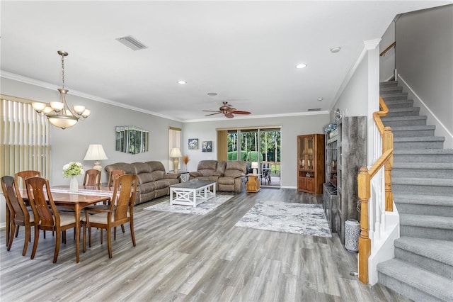 living room featuring crown molding, ceiling fan with notable chandelier, and light hardwood / wood-style flooring