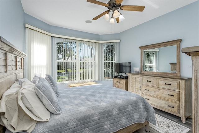 bedroom with wood-type flooring and ceiling fan