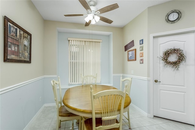 dining area featuring light tile patterned flooring and ceiling fan