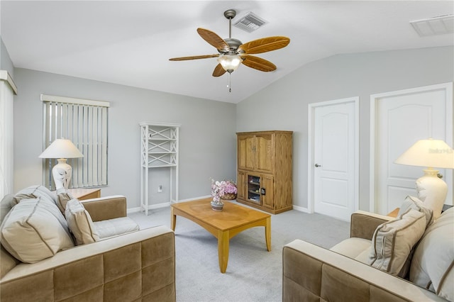 living room with light carpet, lofted ceiling, and ceiling fan