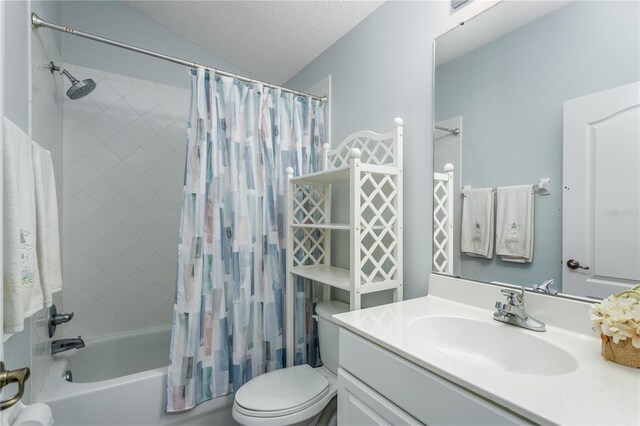 full bathroom with lofted ceiling, toilet, a textured ceiling, vanity, and shower / bath combo with shower curtain