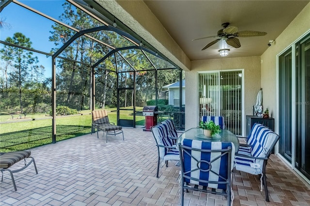 view of patio featuring a grill, a lanai, and ceiling fan