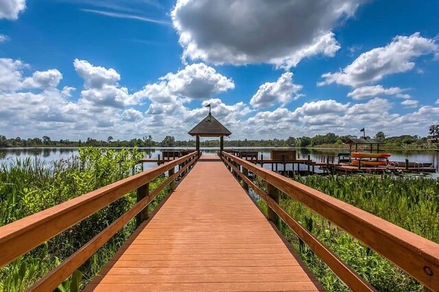 dock area with a gazebo and a water view