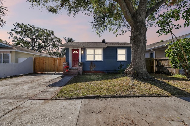 ranch-style house with a lawn