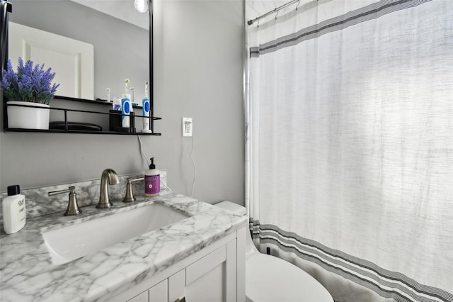 bathroom with vanity and toilet