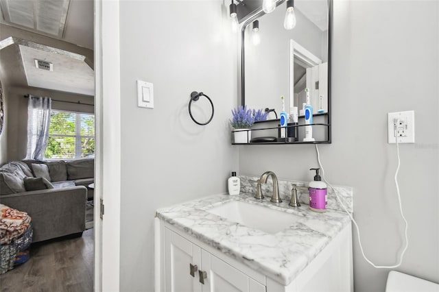 bathroom featuring vanity and hardwood / wood-style flooring