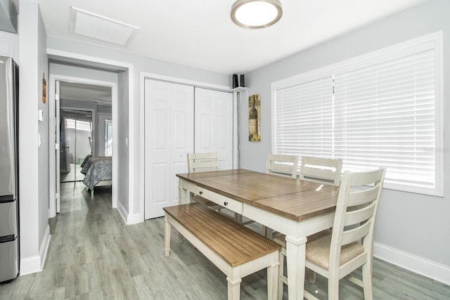 dining space featuring light wood-type flooring and a wealth of natural light