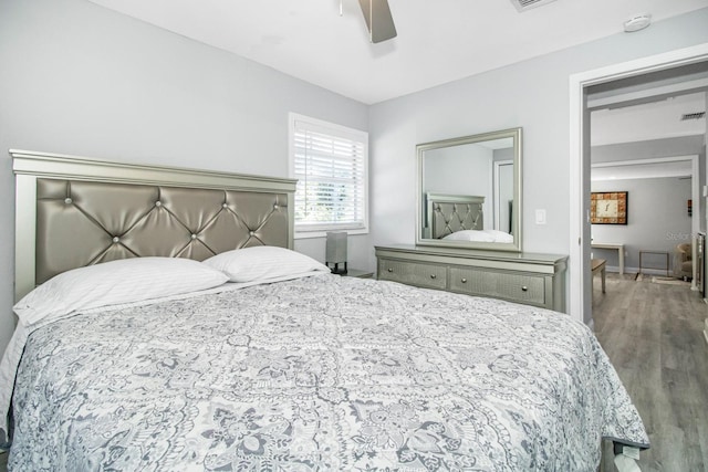 bedroom with hardwood / wood-style floors and ceiling fan