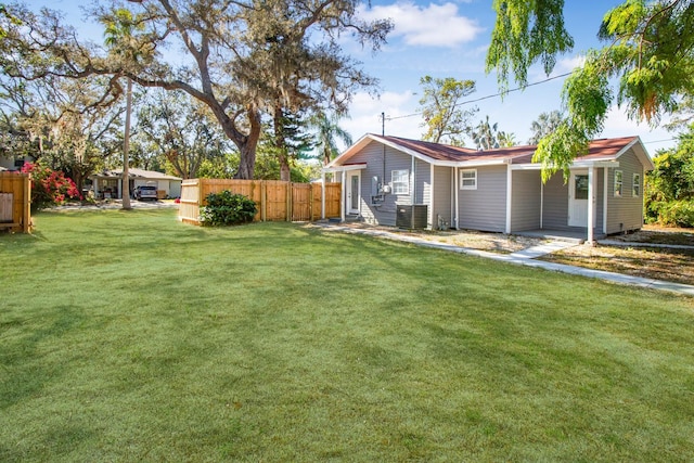 view of yard with central AC